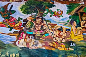 Luang Prabang, Laos - Wat Xieng Mouan with the faade decorated with brightly painted Jataka tales. 